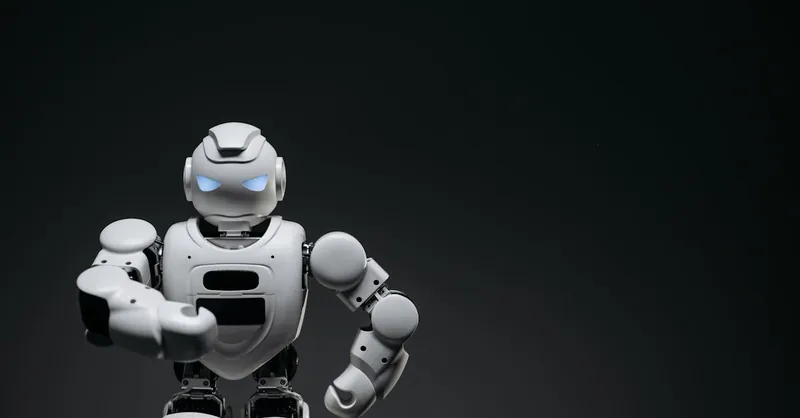 A sleek white robot showcasing modern robotics technology against a dark backdrop.