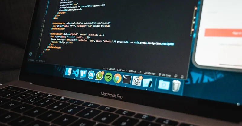 Close-up of a laptop with code on the screen, perfect for illustrating programming concepts.