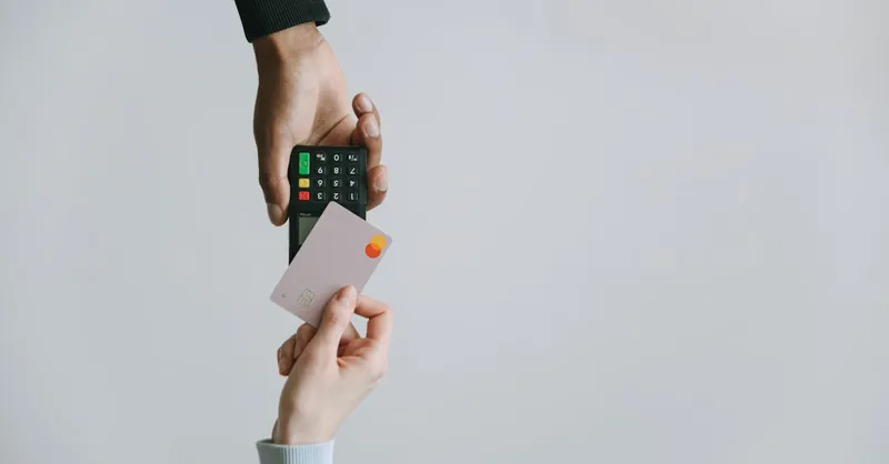 Modern contactless payment using a card and terminal, highlighting the ease of digital transactions.
